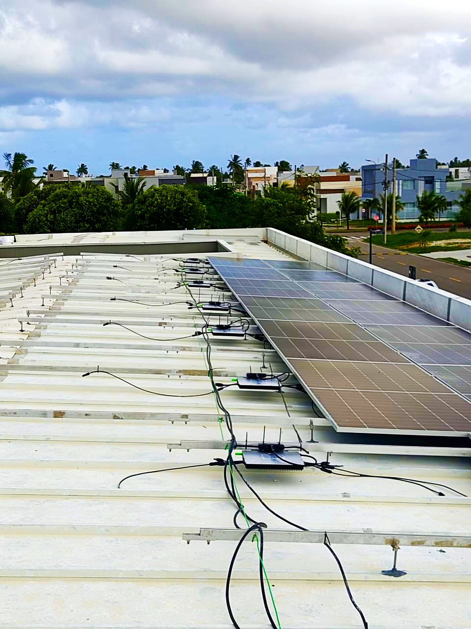 Hoymiles-microinverters-installed-under-solar-panels.png